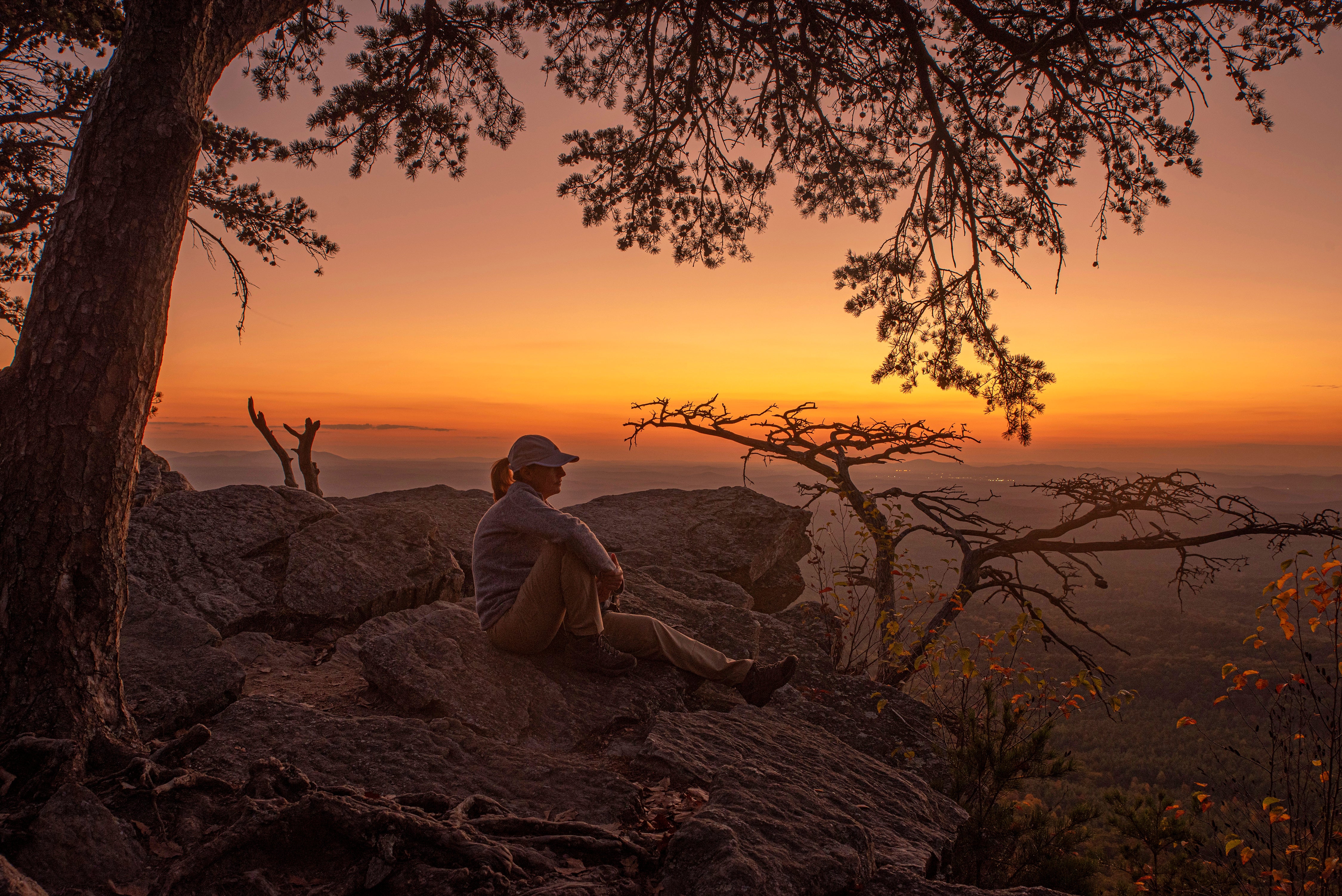 Photo: John Denney III took first place in the State Parks Category of the 2024 contest with this image of a hiker at Pulpit Rock in Cheaha State Park.