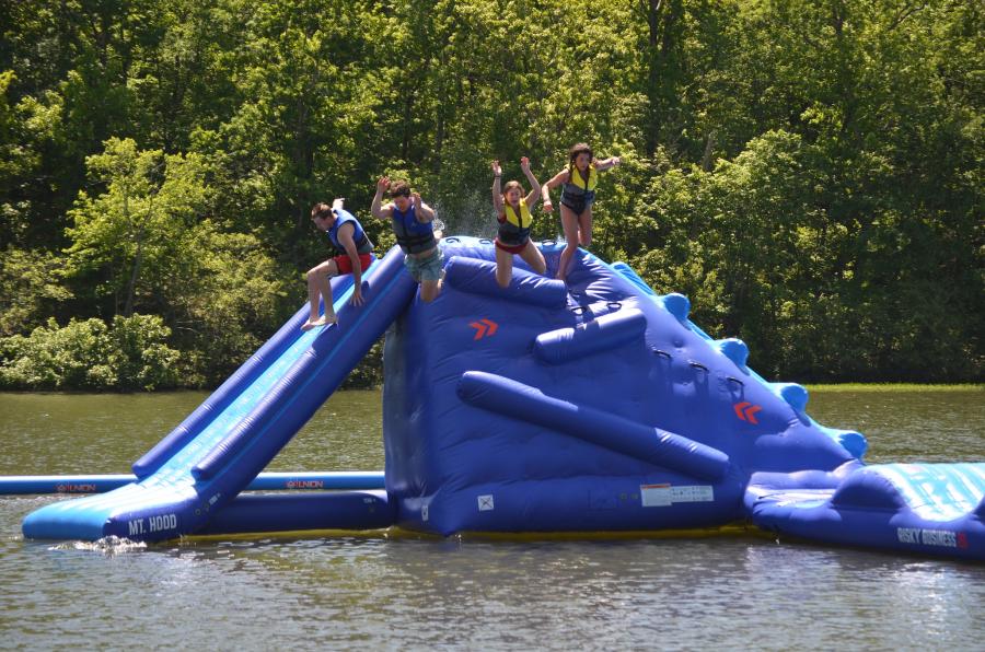Swimmers prepare for splashdown after leaping from the new Flip Side Watersports inflatable 'Mt. Hood' at Oak Mountain State Park. 